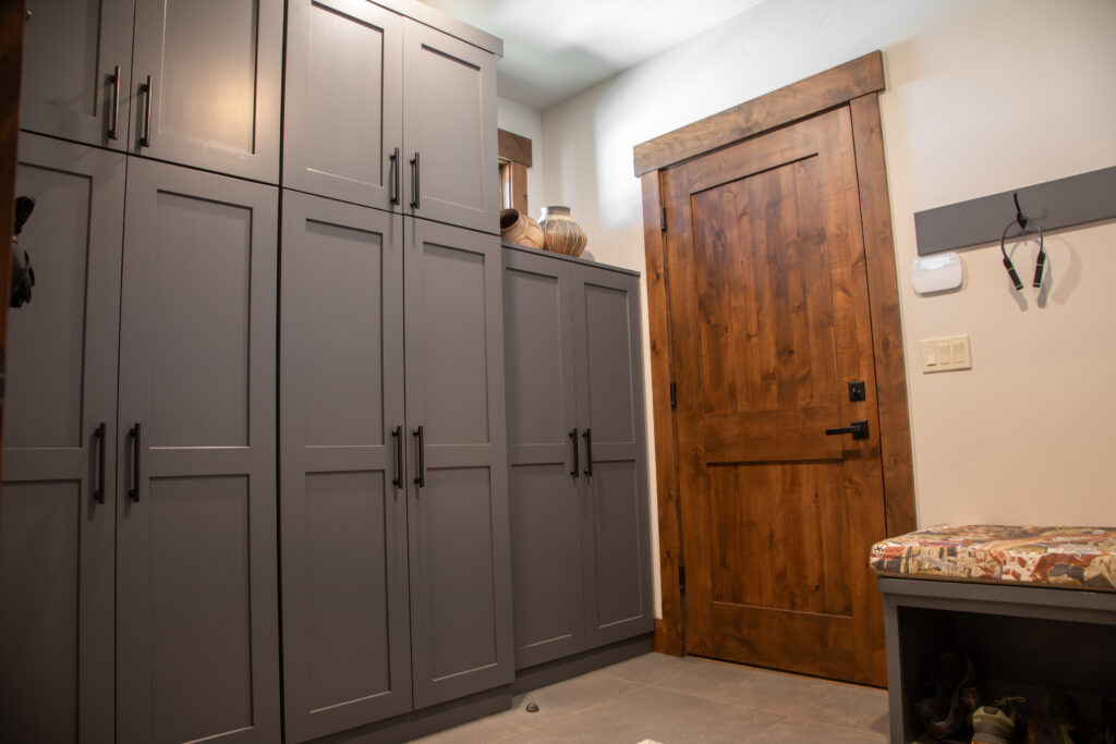 Wooden door next to cabinets